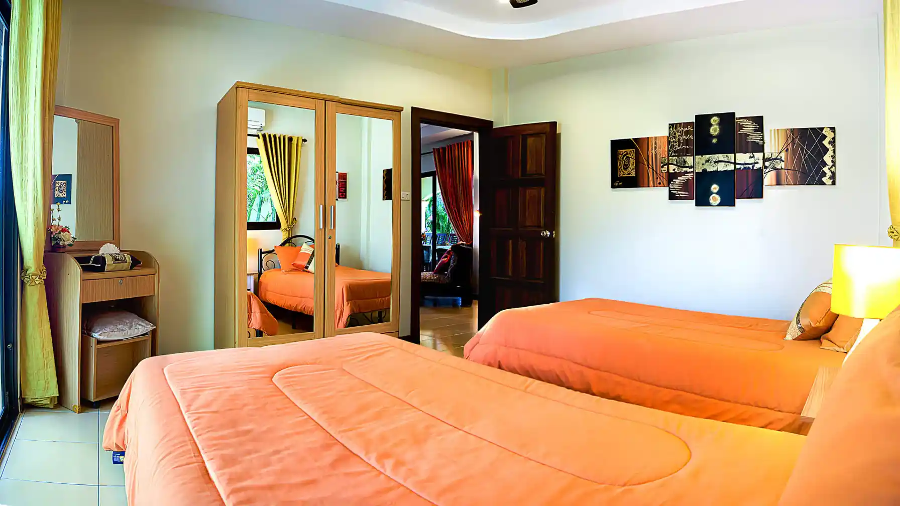 Coconut Paradise Villa twin bedroom with patio doors