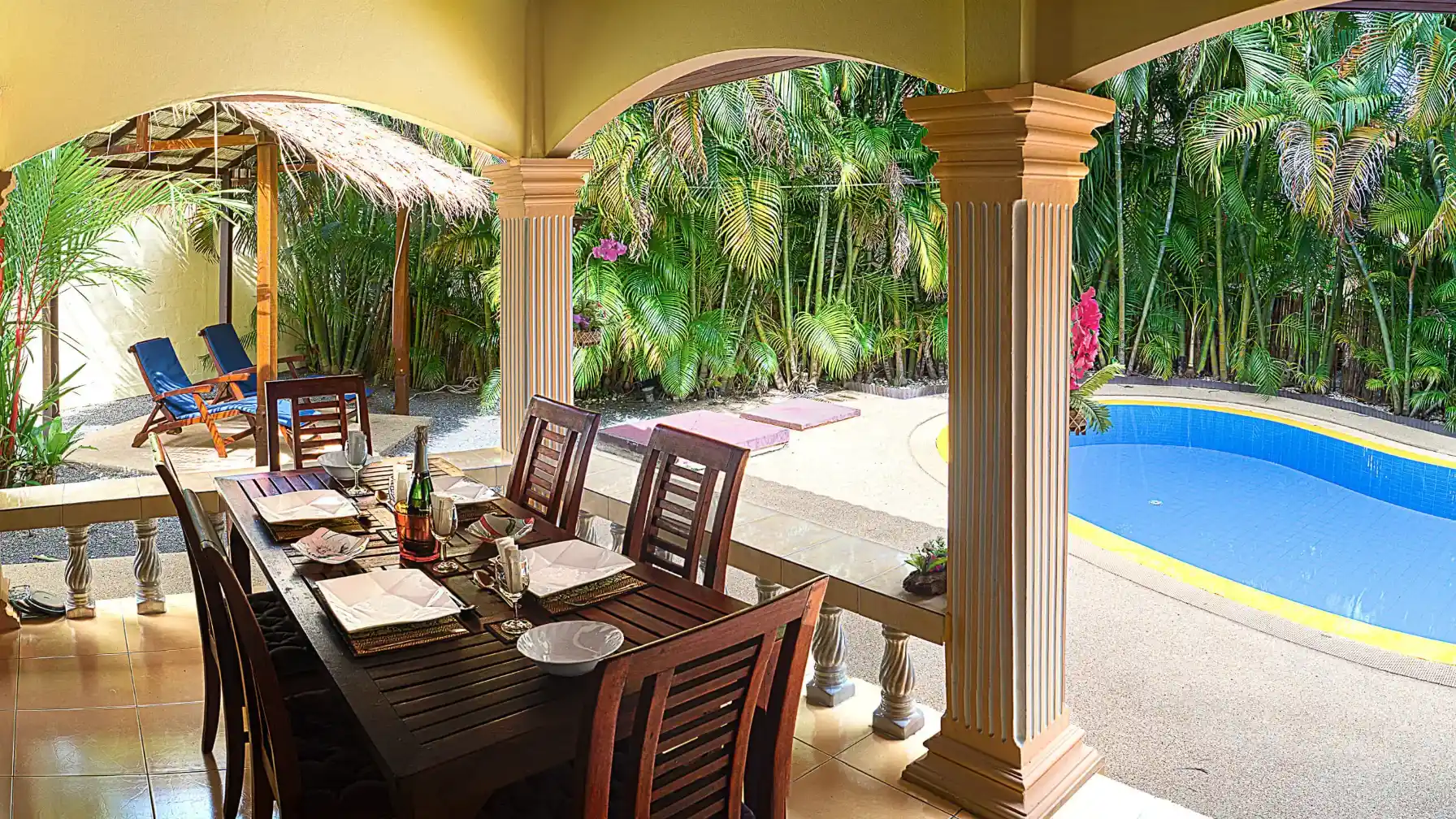 Coconut Paradise Villa covered patio seating