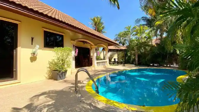 Coconut Paradise Villa pool deck at midday