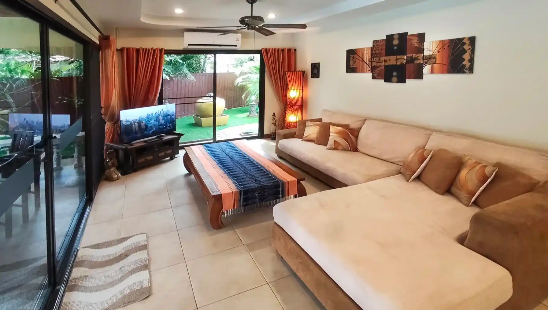 The Coconuts Villa lounge with sliding doors to pool