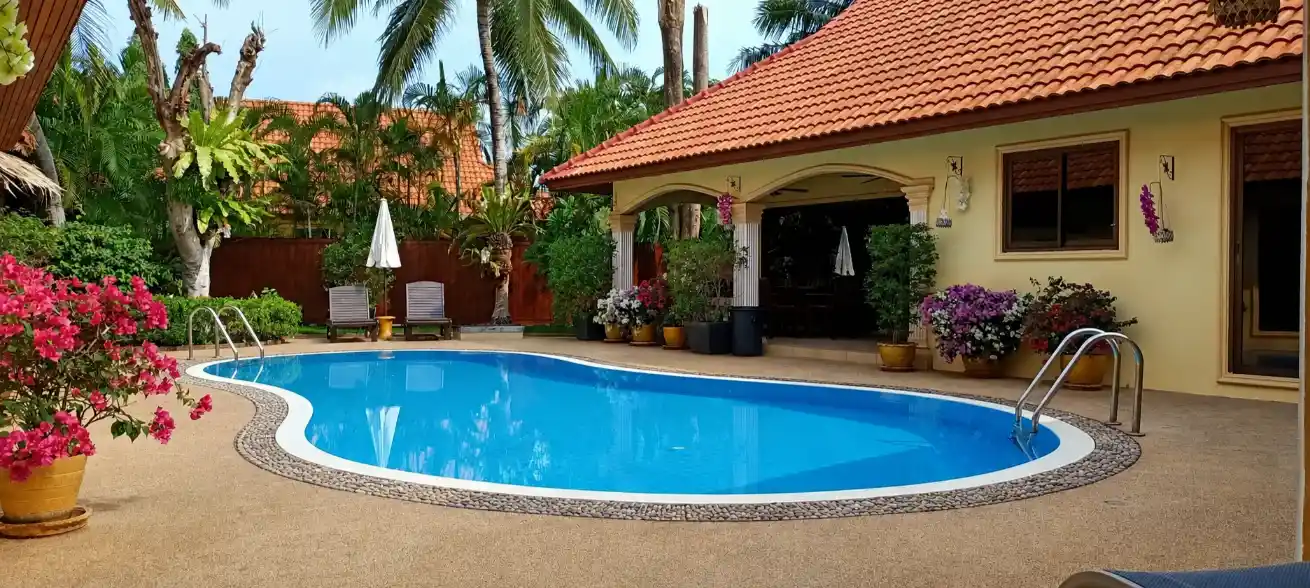 The Coconuts Villa pool and courtyard evening