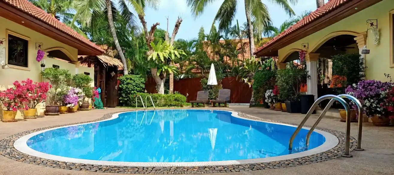 The Coconuts Villa pool at sunset